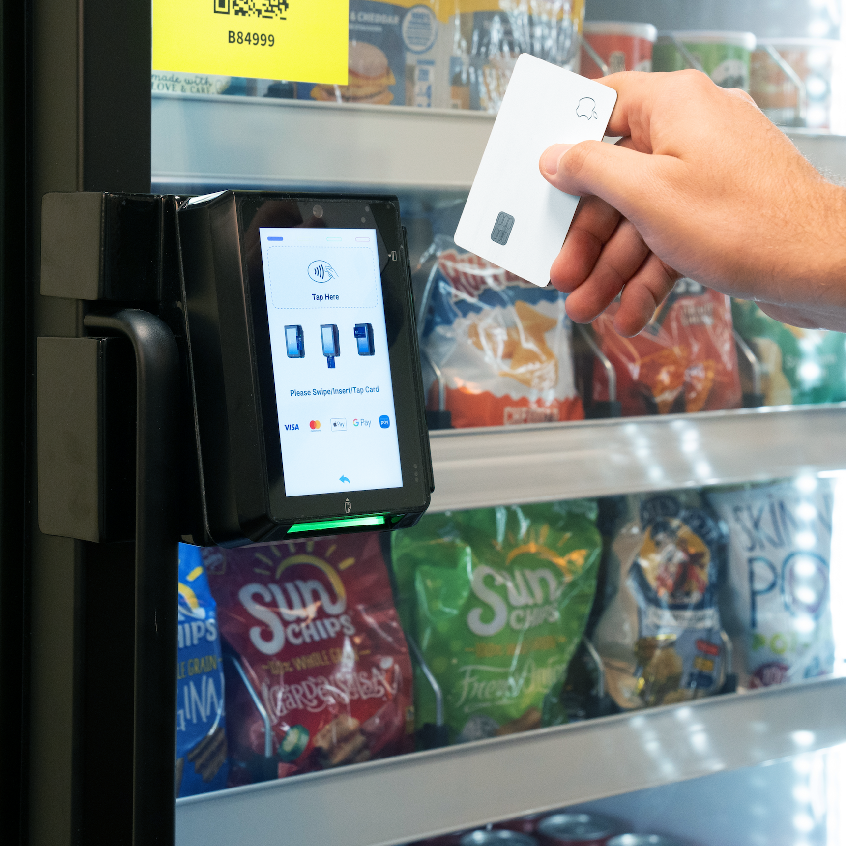 Image showing man swiping a credit card on the POS to open the Genius Vend AI Smart Cooler